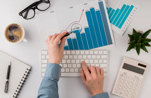 top-view-office-desk-with-growth-chart-analyzed-with-magnifying-glass_23-2148780618 top-view-office-desk-with-growth-chart-analyzed-with-magnifying-glass_23-2148780618