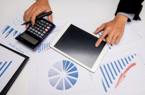 business-documents-office-table-with-smart-phone-digital-tablet-man-working-background