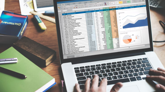 closeup-hands-using-computer-laptop-with-screen-showing-analysis-data_53876-23014